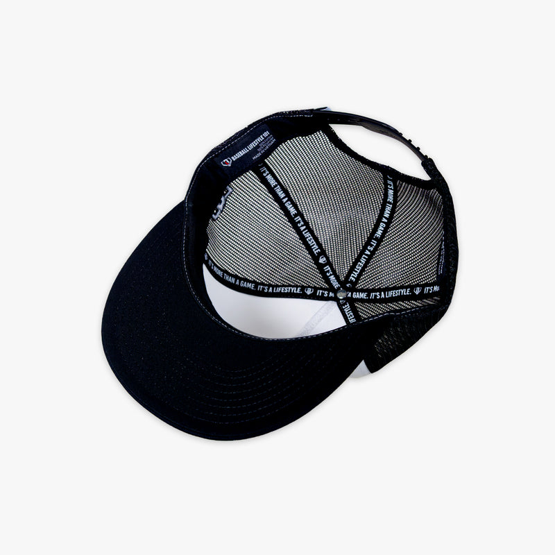Black and white cap with mesh back on a white background
