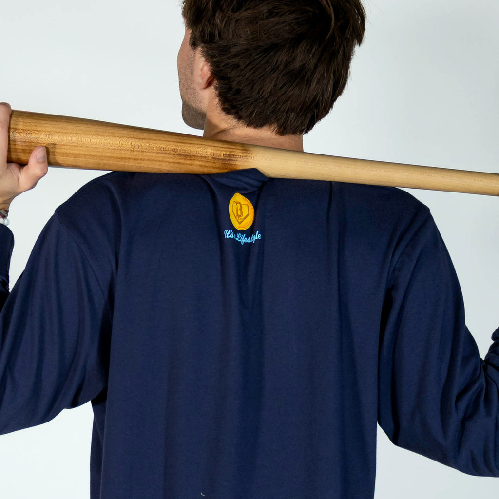 Adult model wearing navy graphic tee with "Spin & Swing Long Sleeve" design