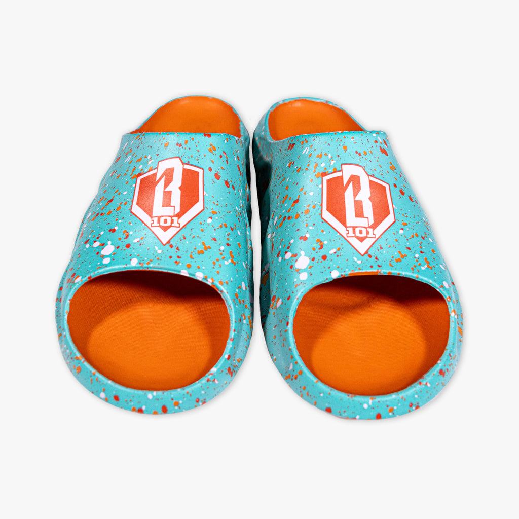 Pair of teal and orange slippers with a BL101 logo on a white background