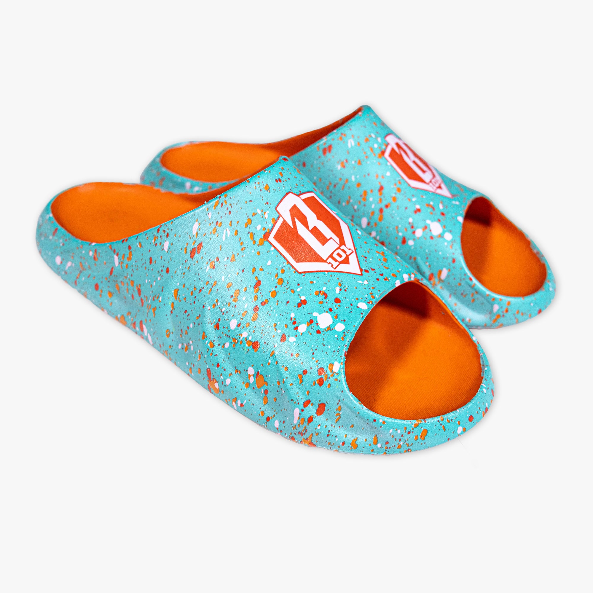 Pair of teal and orange slippers with a BL101 logo on a white background