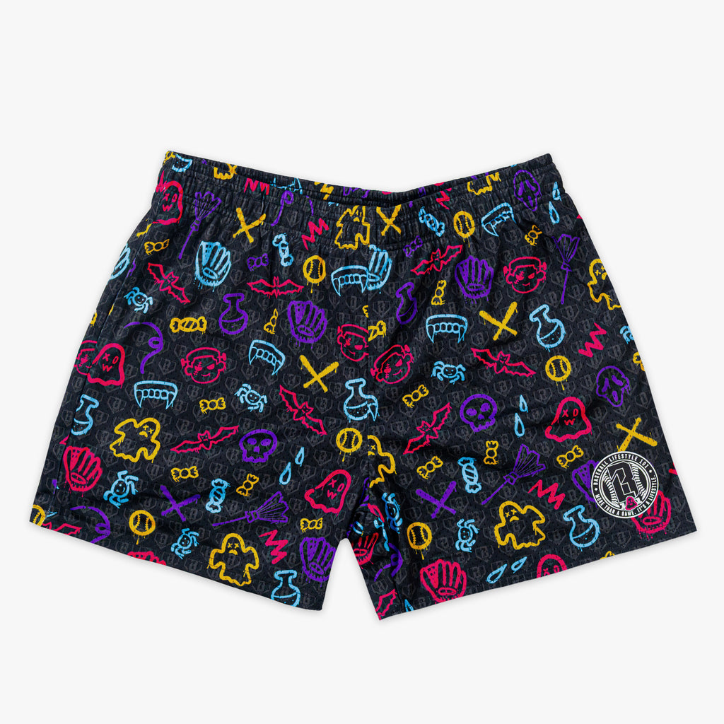 Halloween patterned shorts with ghosts, bats, spiders and baseballs on a white background