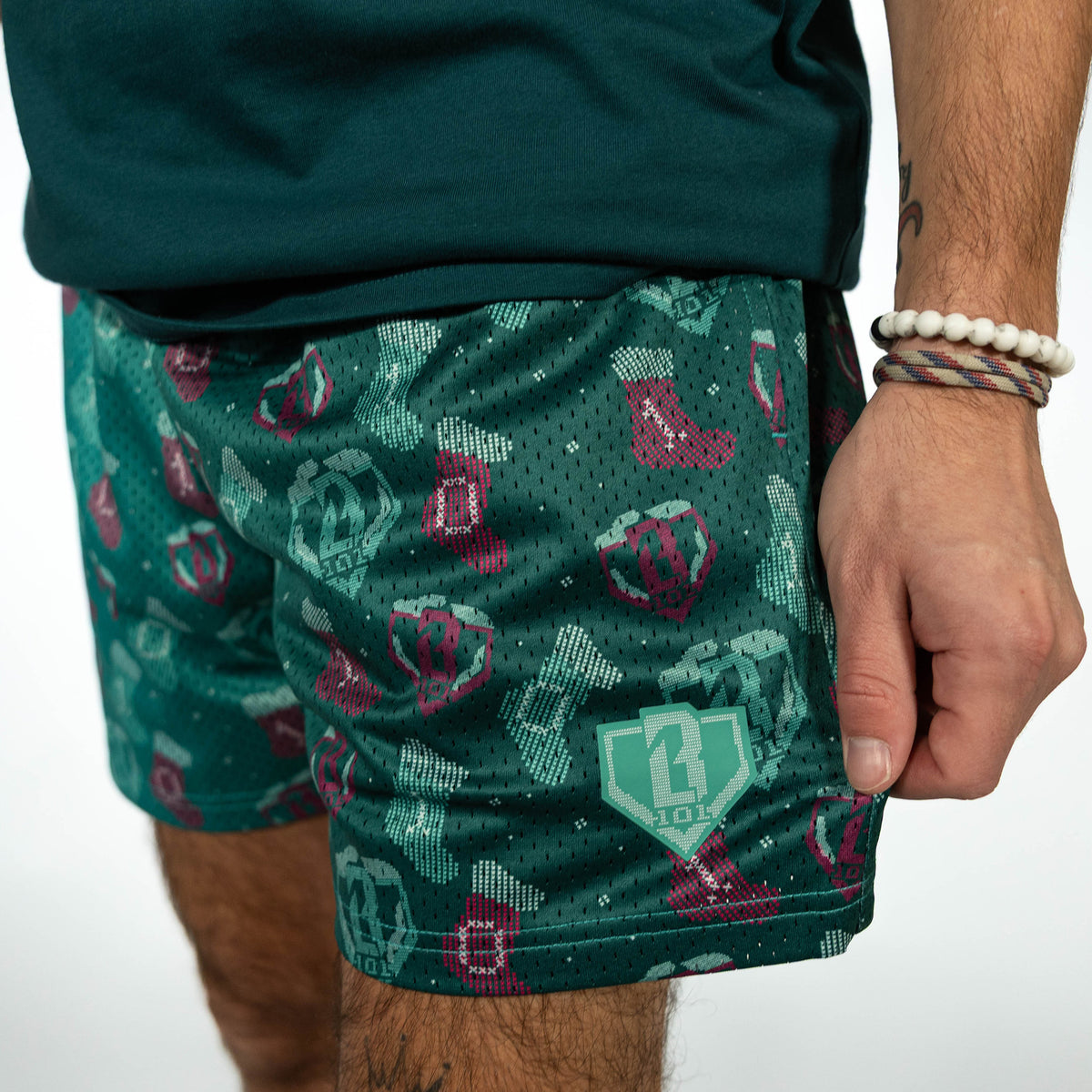 Adult model wearing green Stitched For The SZN shorts