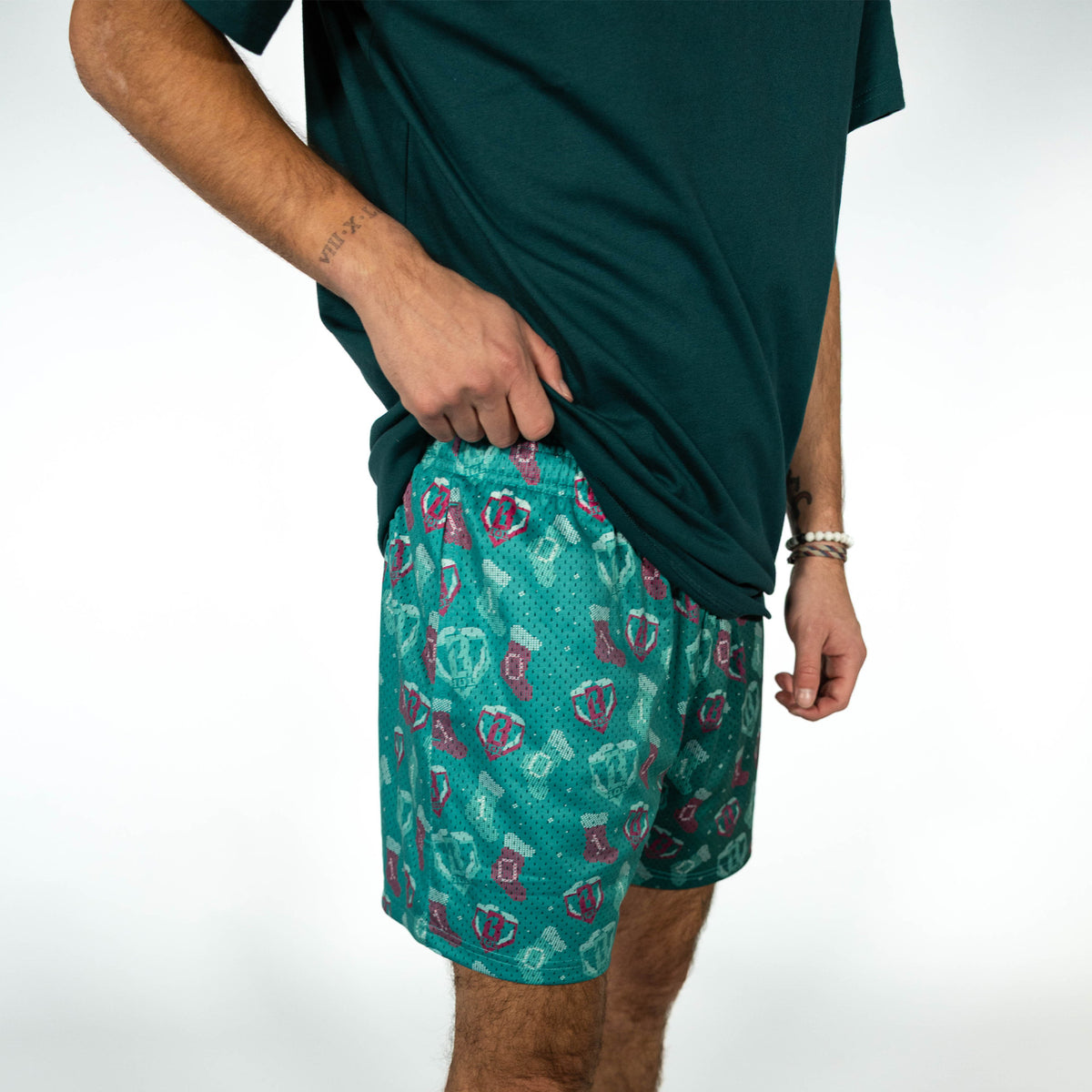 Adult model wearing green Stitched For The SZN shorts