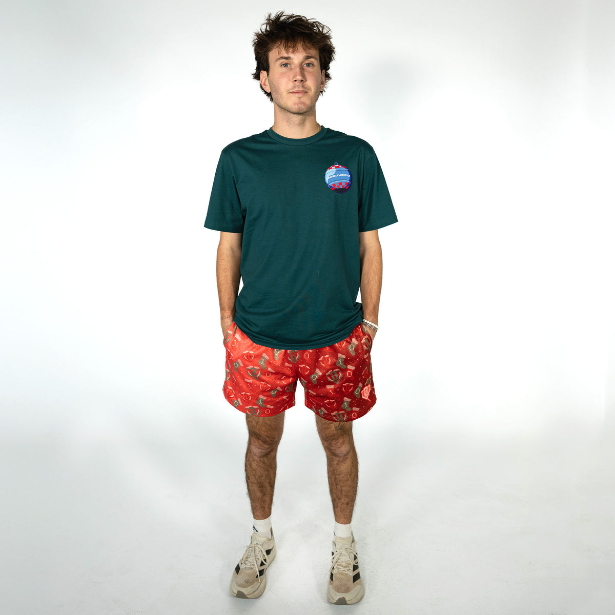 Adult model wearing red Stitched For The SZN shorts