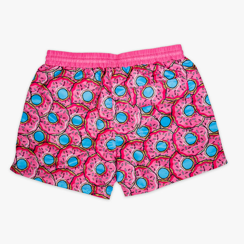 Pink swim shorts with donut pattern on a white background