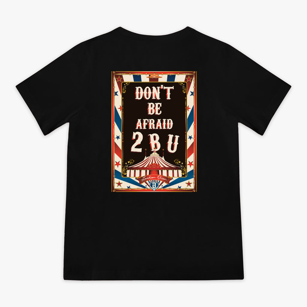 Black t-shirt with a graphic design featuring 'Don't Be Afraid 2 B U' text and a circus tent on a white background