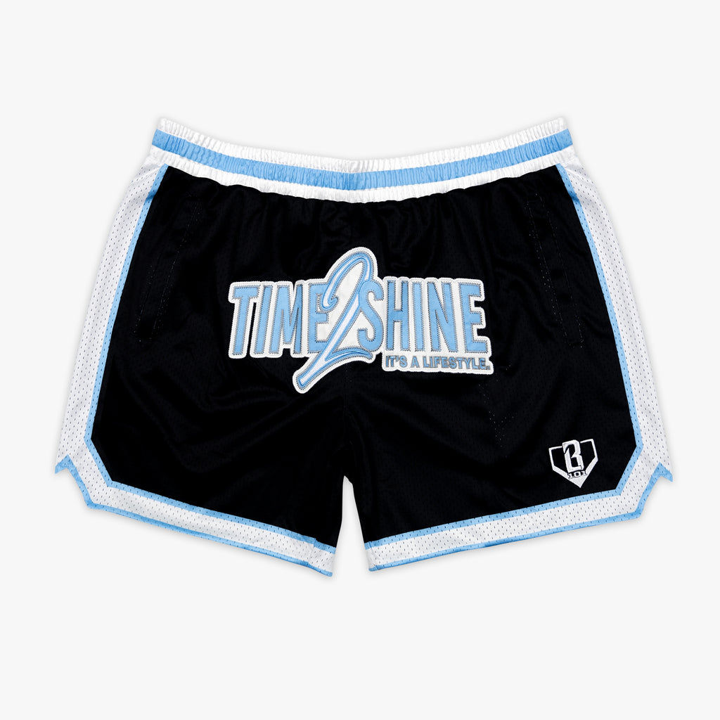 Youth model wearing youth shorts with "Time 2 Shine" design