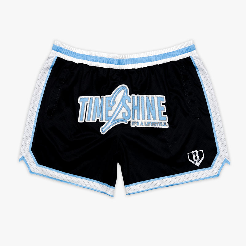 Youth model wearing youth shorts with "Time 2 Shine" design