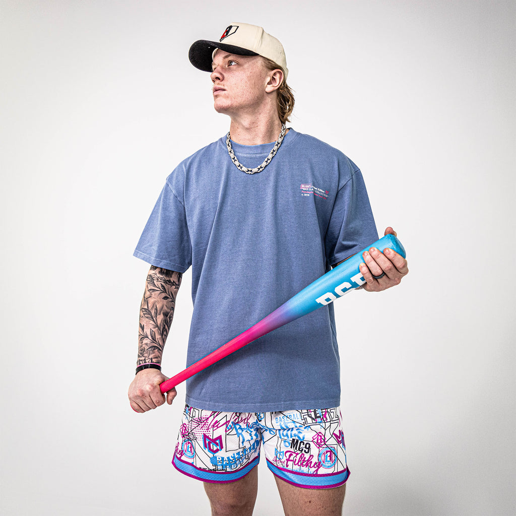 Adult model wearing shorts with “Time 2 Shine Icons” design