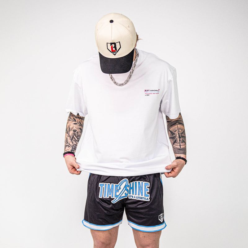 Adult model wearing shorts with "Time 2 Shine" design