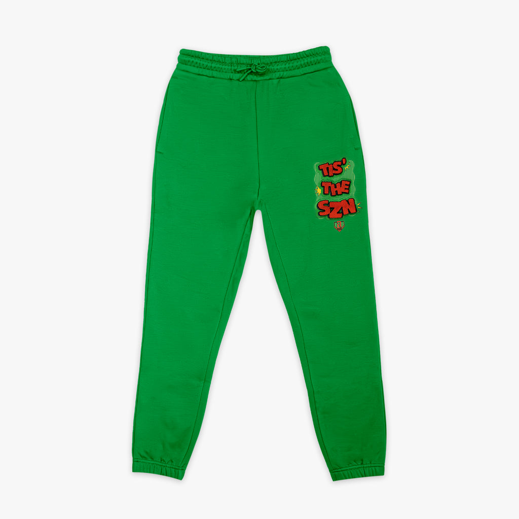 Green youth sweatpants with "Tis The SZN" design — front view