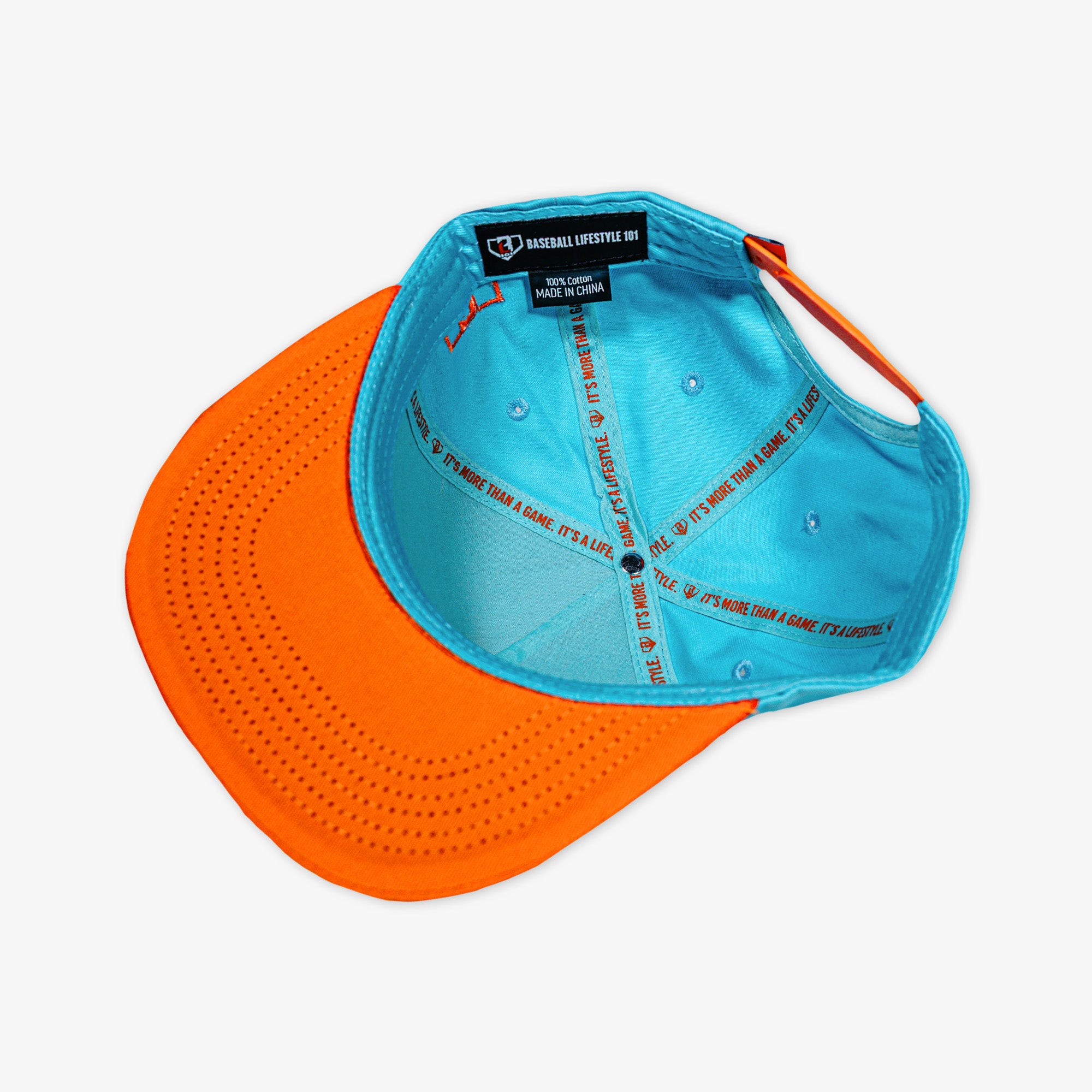 Adult model wearing blue hat with "Trash Talk" design