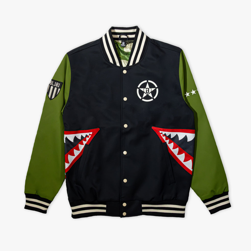 Black and green varsity jacket with white embroidered star logo on chest, BL101 armor patch on sleeve, and red shark mouth pocket designs