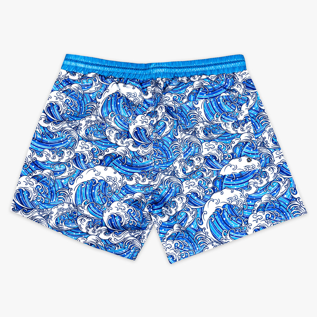 Blue and white wave patterned shorts on a white background