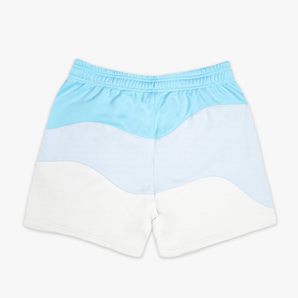 Light blue and white color-blocked shorts on a white background
