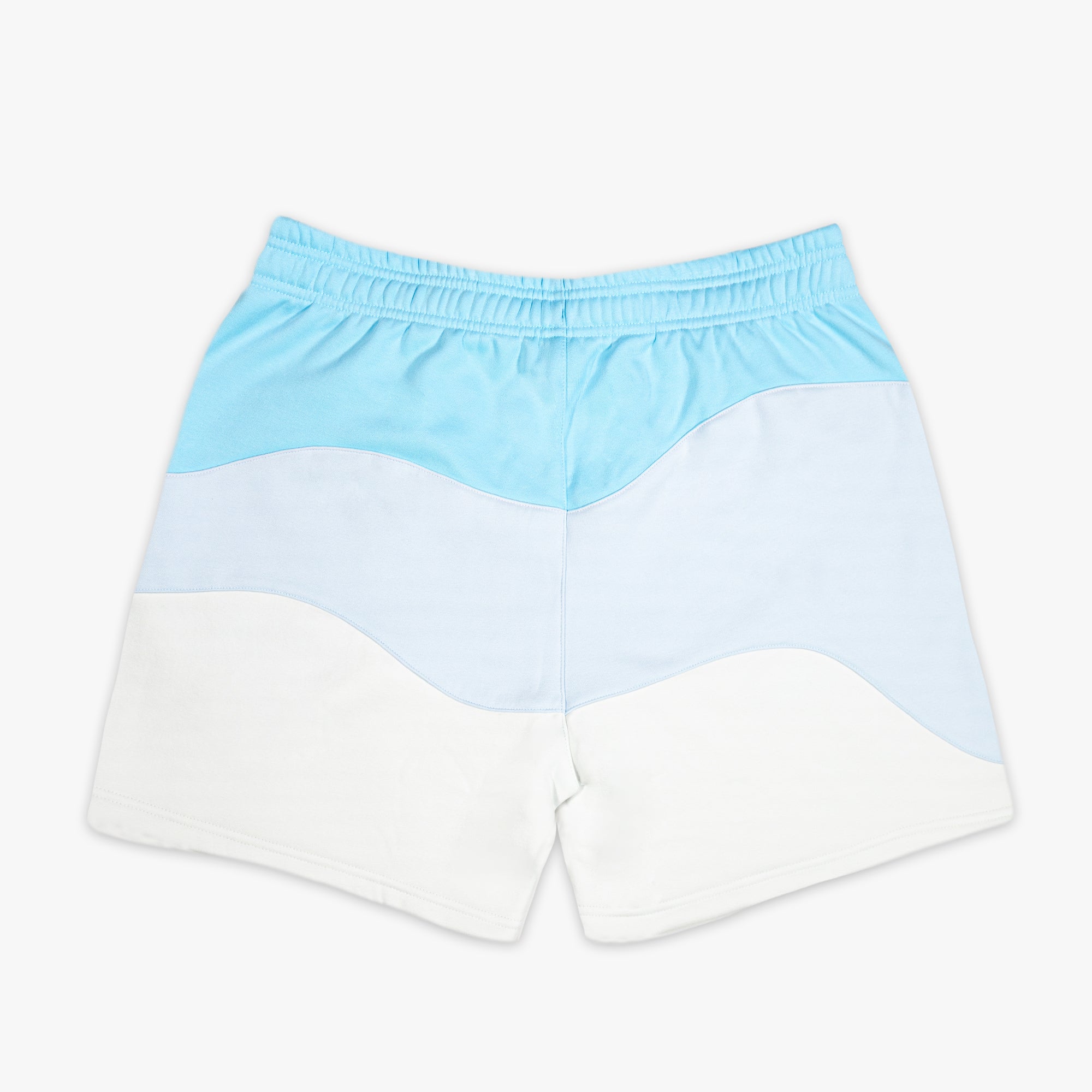 Light blue and white color-blocked shorts on a white background