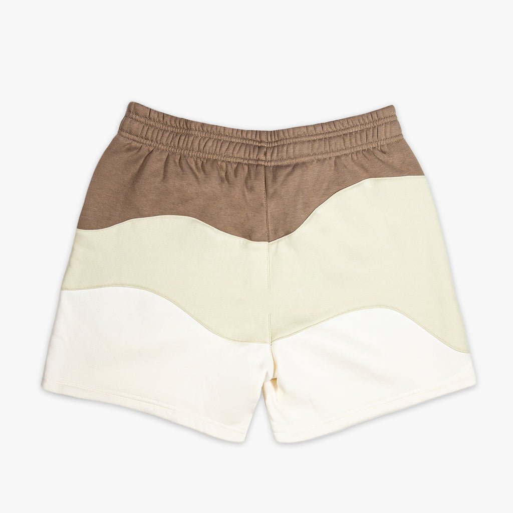 Brown and beige shorts on a white background