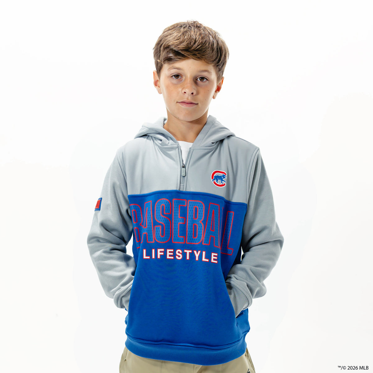 Youth model wearing blue Chicago Cubs Color Block youth quarter zip
