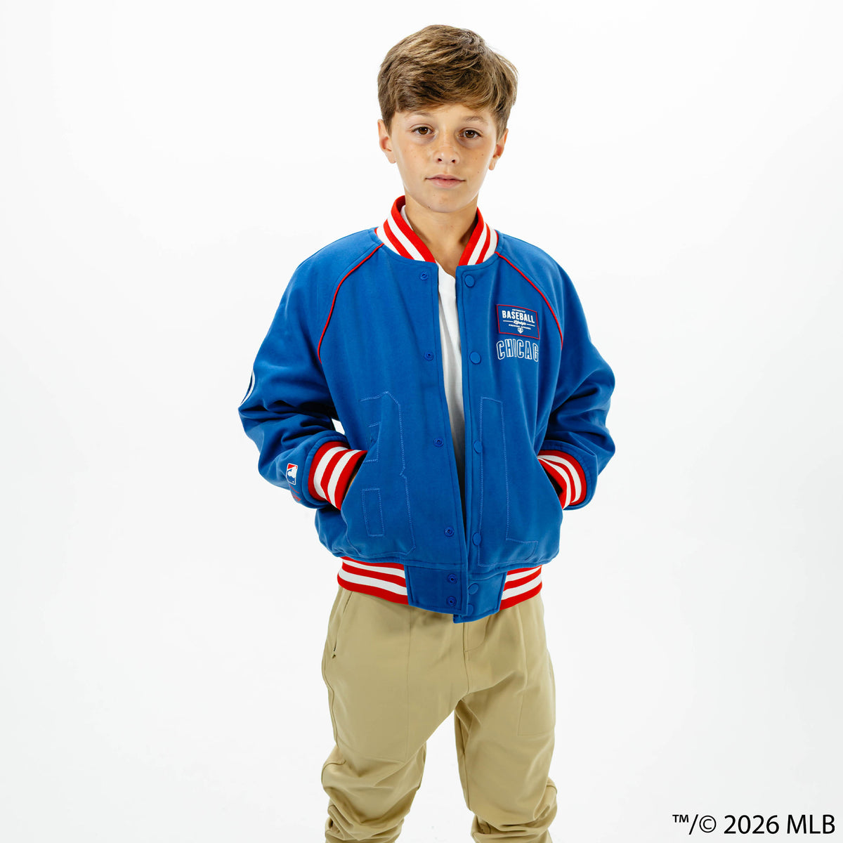 Youth model wearing blue Chicago Cubs Stadium youth bomber jacket