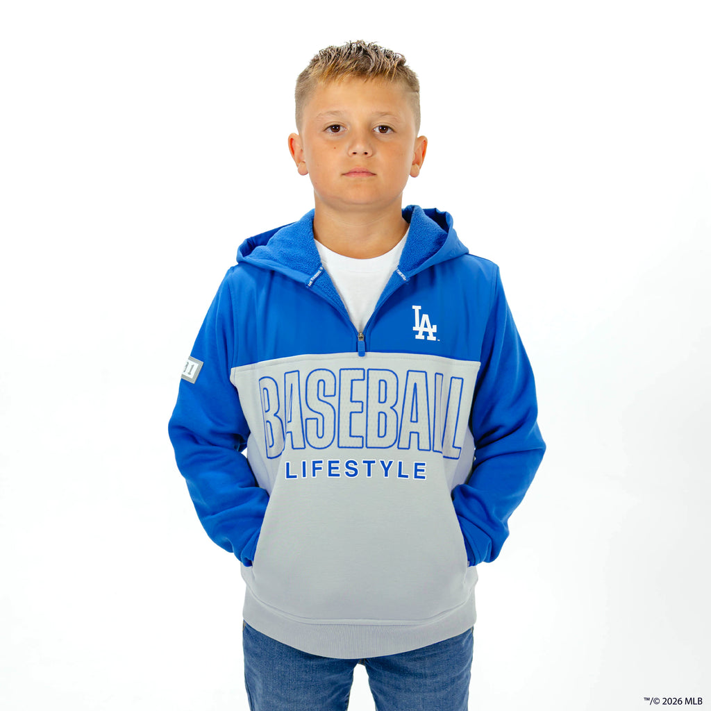 Youth model wearing blue Los Angeles Dodgers Color Block youth quarter zip