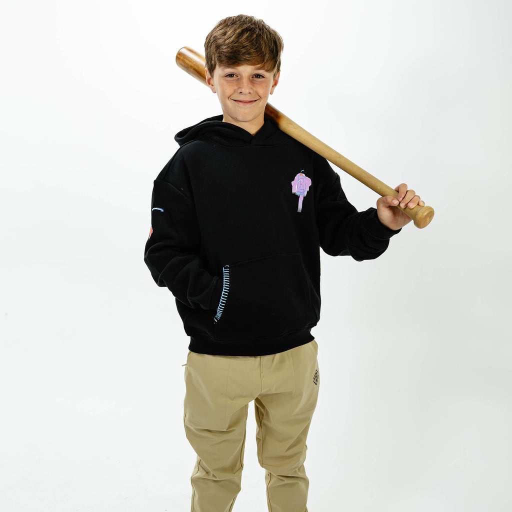 Youth model wearing black youth hoodie with "Fastball Scoops" design