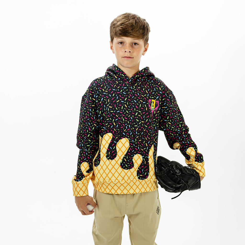 Youth model wearing black Ice Cream Midnight Sundae youth hoodie with "Ice Cream" design