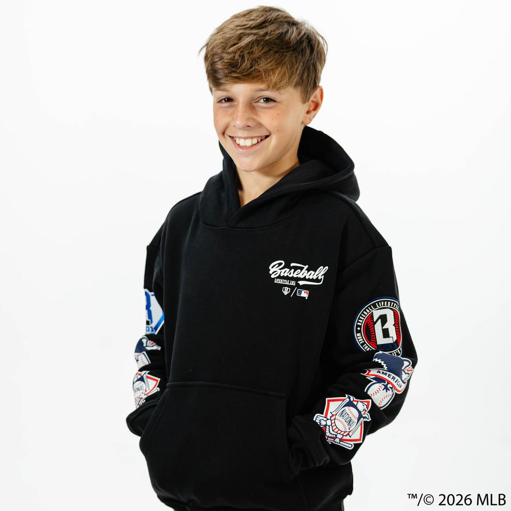 Youth model wearing black BL101 x MLB Established League youth hoodie