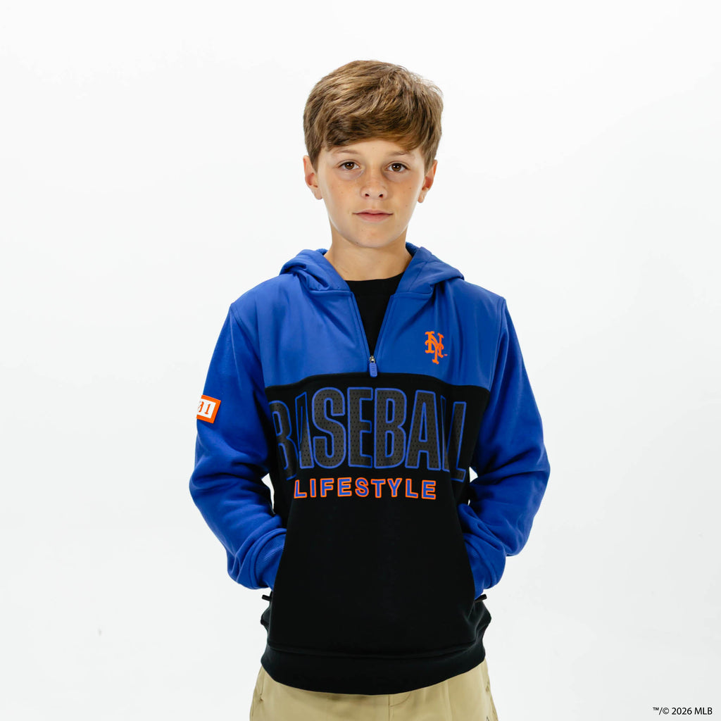 Youth model wearing blue New York Mets Color Block youth quarter zip