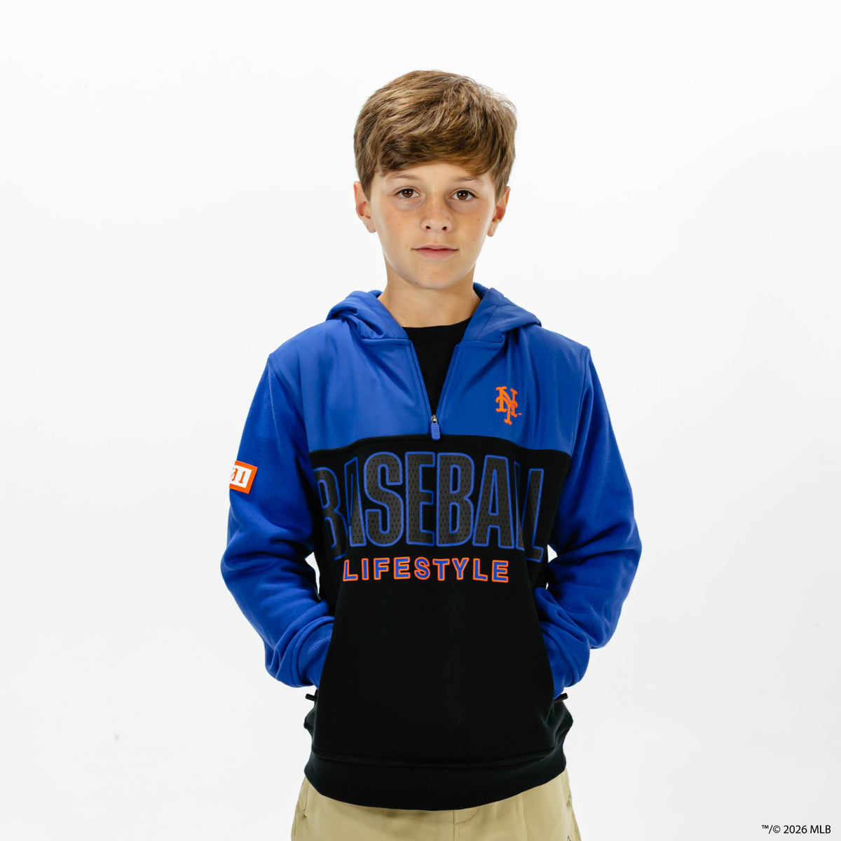 Youth model wearing blue New York Mets Color Block youth quarter zip