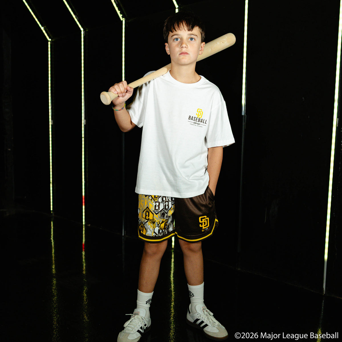 Youth model wearing white youth graphic tee with "San Diego Padres Ice Cream Cap" design