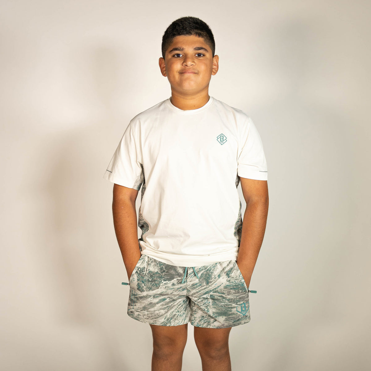 Youth model wearing white Realtree Aspect Diamond Tech Camo youth vented tee