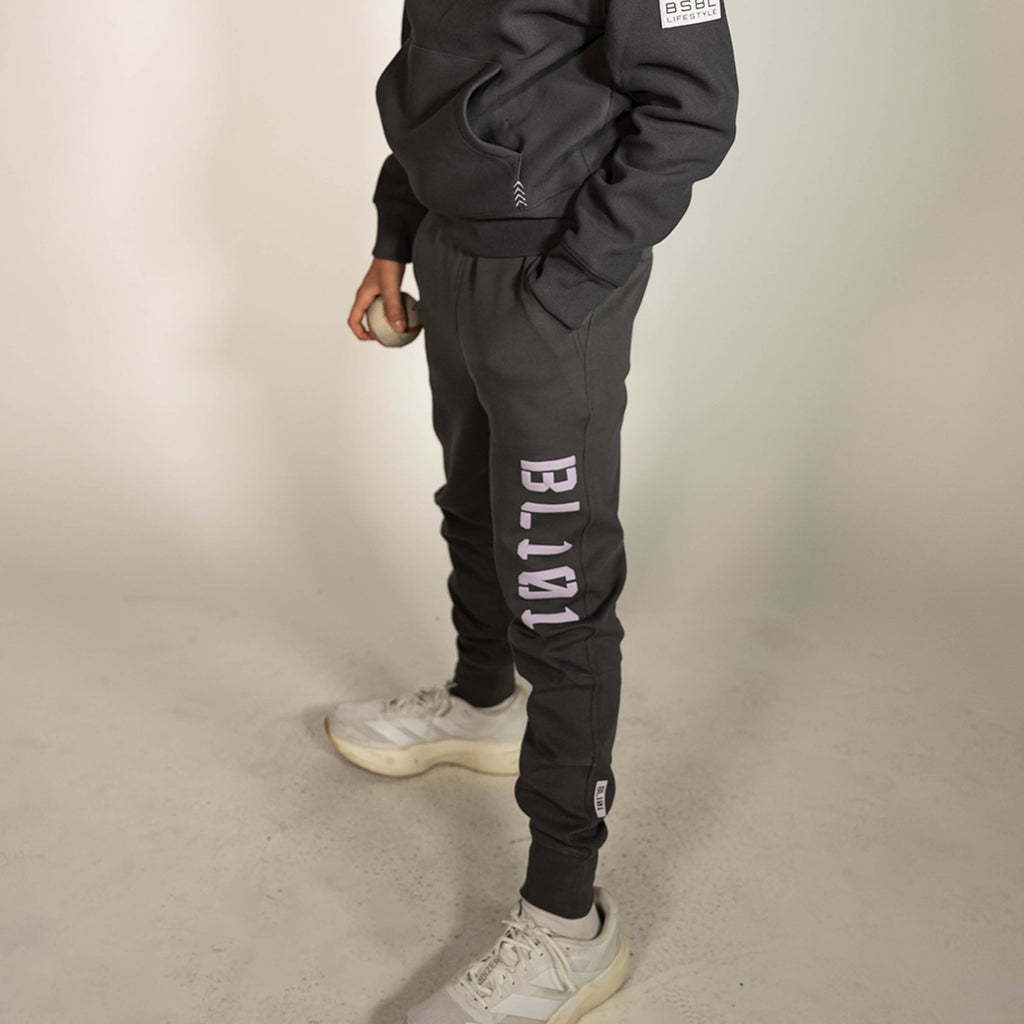 Youth model wearing gray and lilac Diamond Relaxed Fit youth joggers