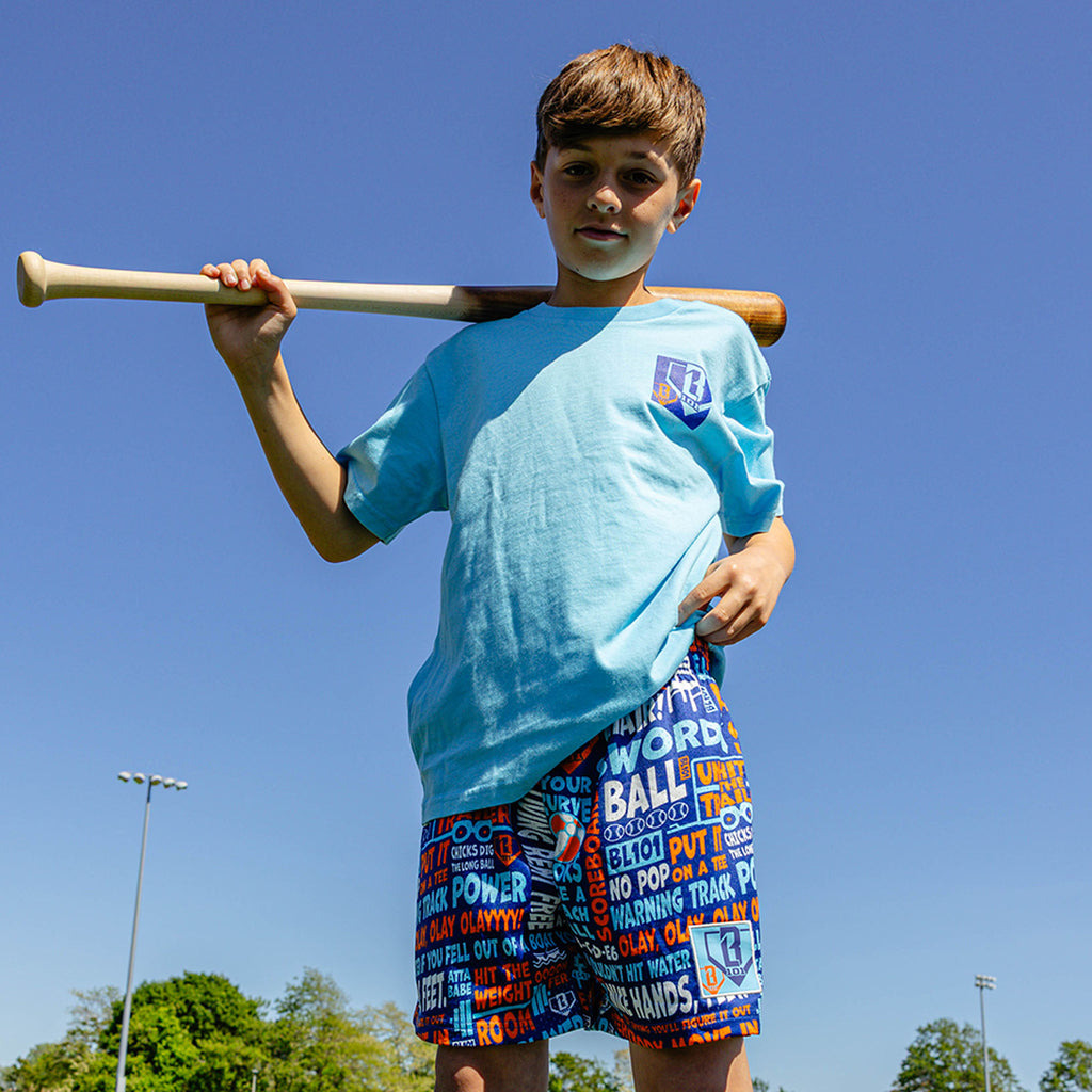 Youth model wearing navy youth shorts with "Trash Talk Youth" design