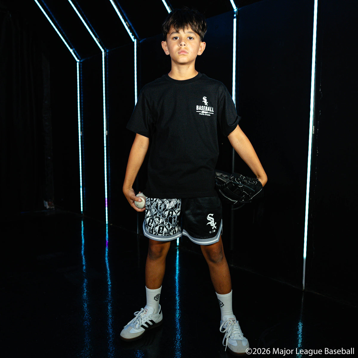 Youth model wearing black youth graphic tee with "Chicago White Sox Ice Cream" design