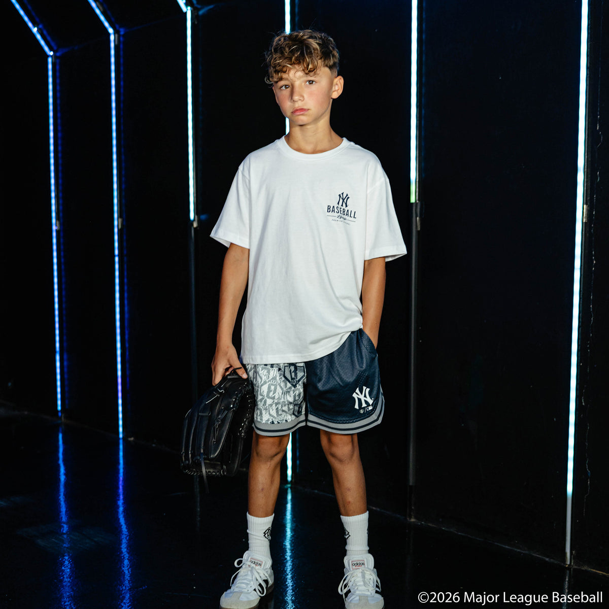 Youth model wearing white youth graphic tee with "New York Yankees Ice Cream" design
