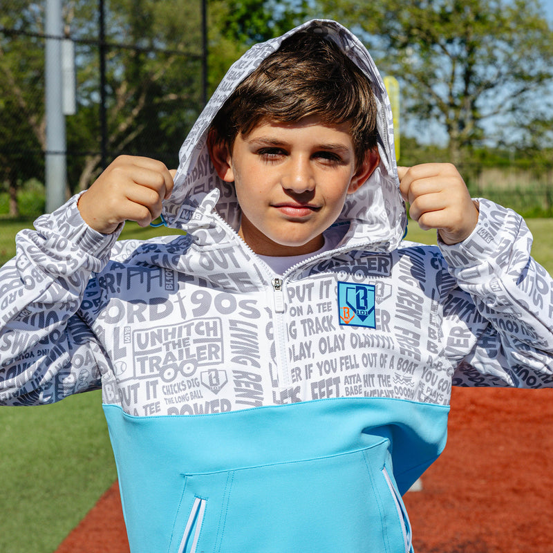 Youth model wearing multi-color youth hoodie with "UVChangeup Trash Talk Youth" design