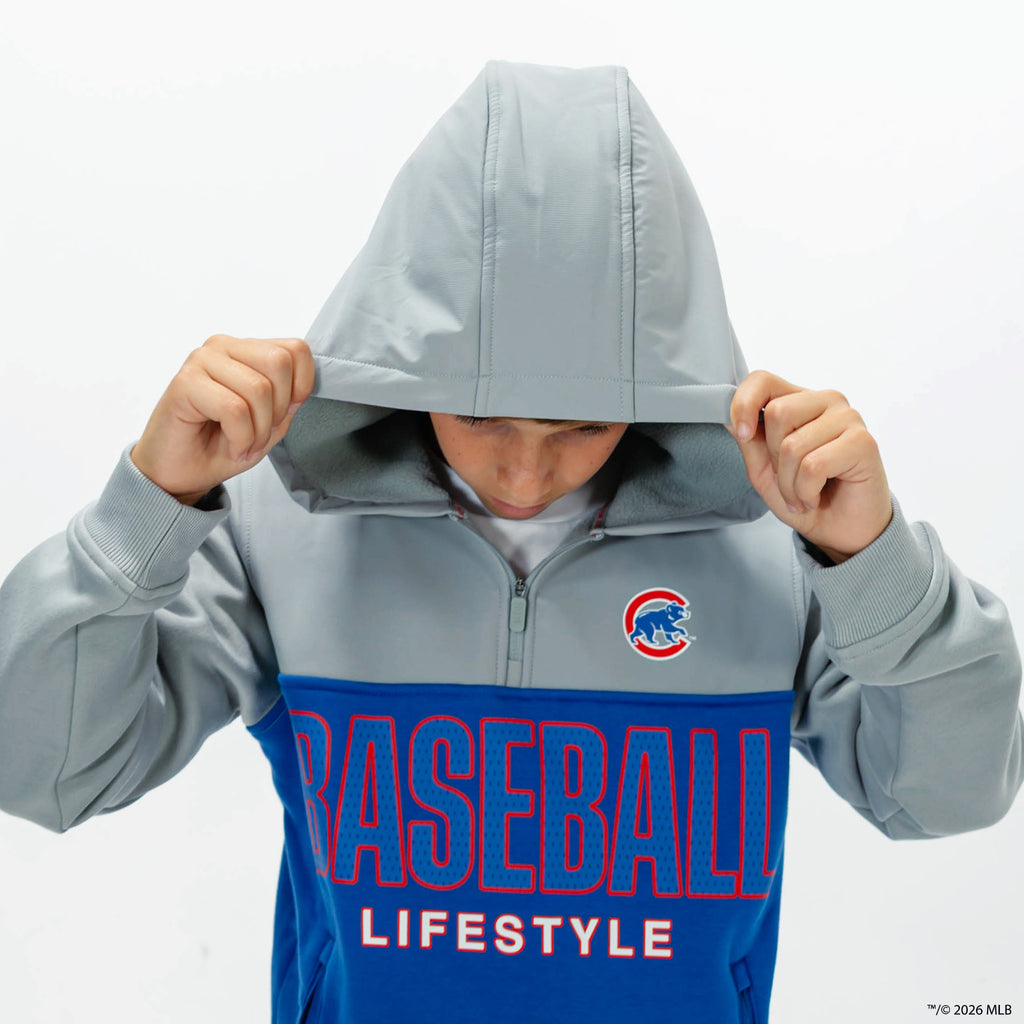 Youth model wearing blue Chicago Cubs Color Block youth quarter zip