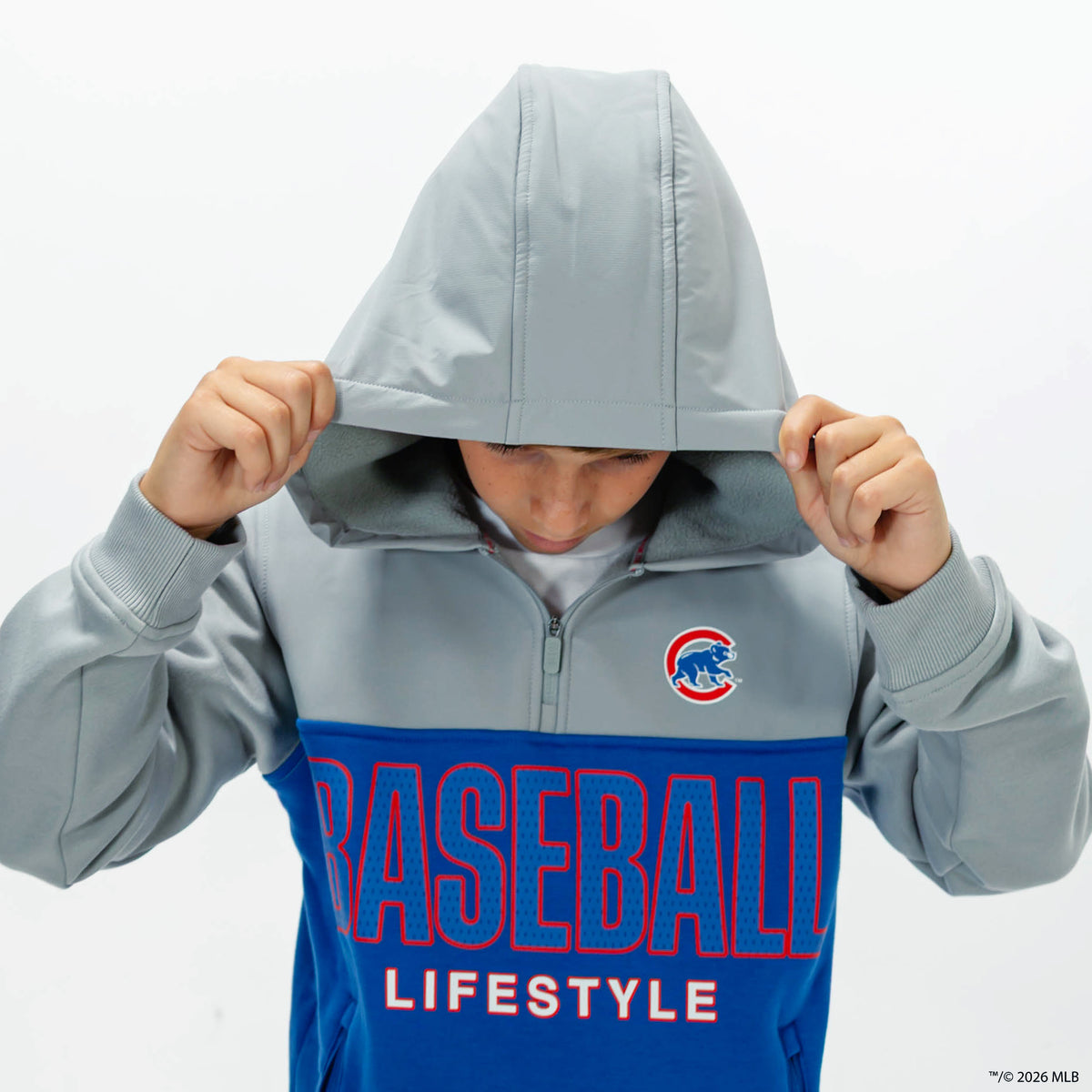 Youth model wearing blue Chicago Cubs Color Block youth quarter zip