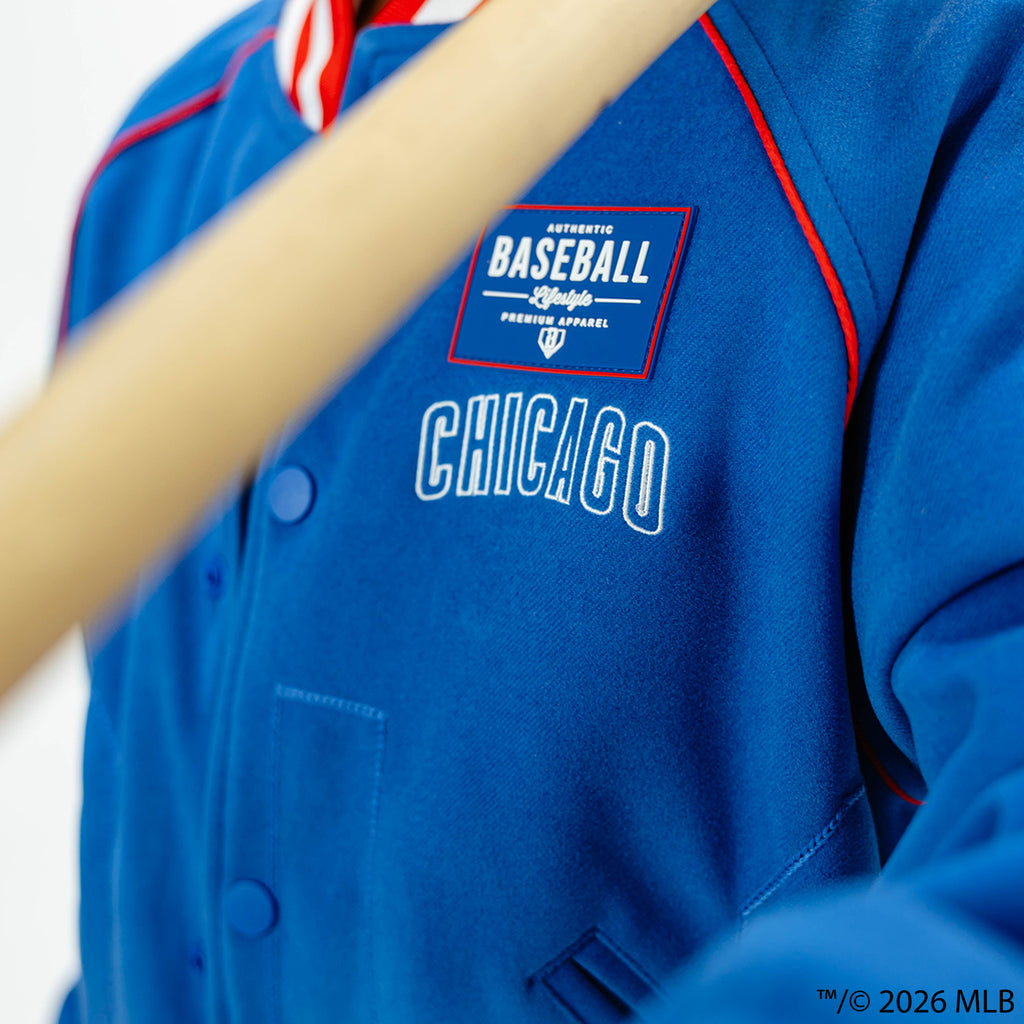 Youth model wearing blue Chicago Cubs Stadium youth bomber jacket