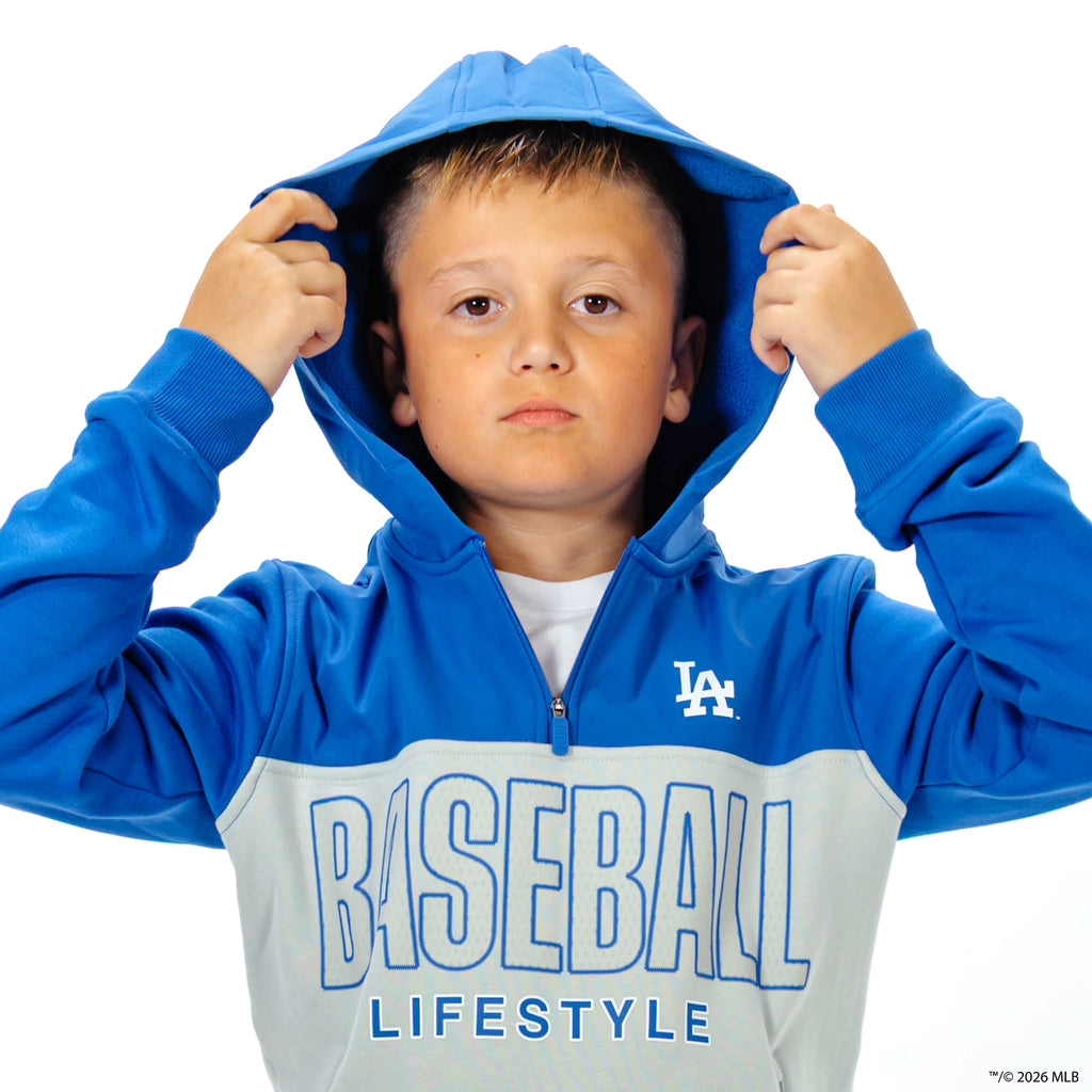 Youth model wearing blue Los Angeles Dodgers Color Block youth quarter zip