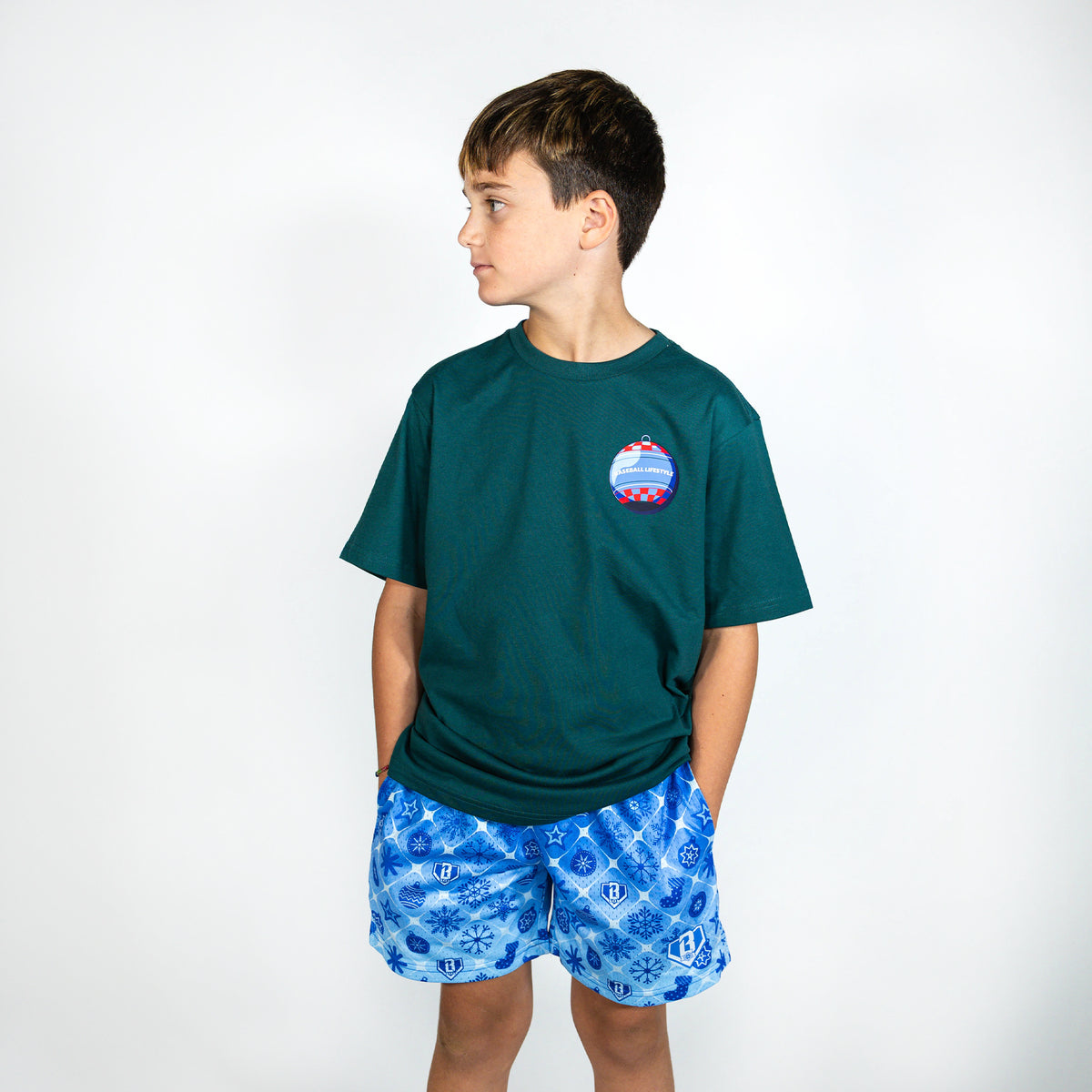 Youth model wearing blue youth shorts with "Frozen Diamond" design