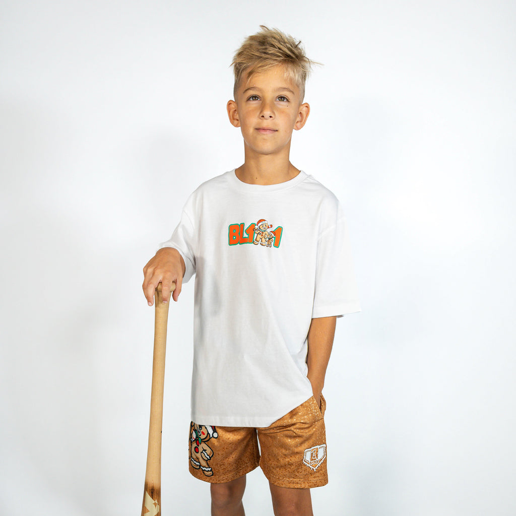Youth model wearing brown youth shorts with "Gingerbread Rookie" design