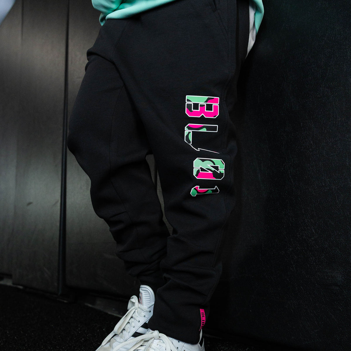 Youth model wearing black relaxed fit joggers with "King Of JUCO Diamond" design