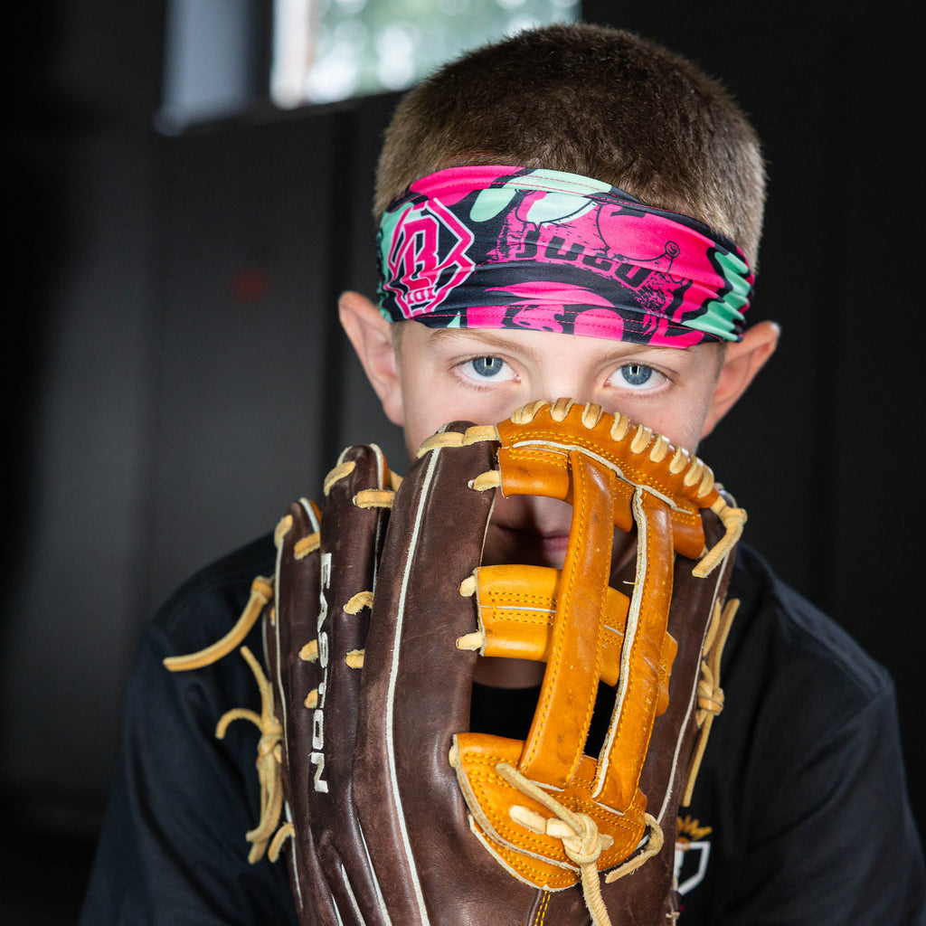Youth model wearing black headband with "King of JUCO" design