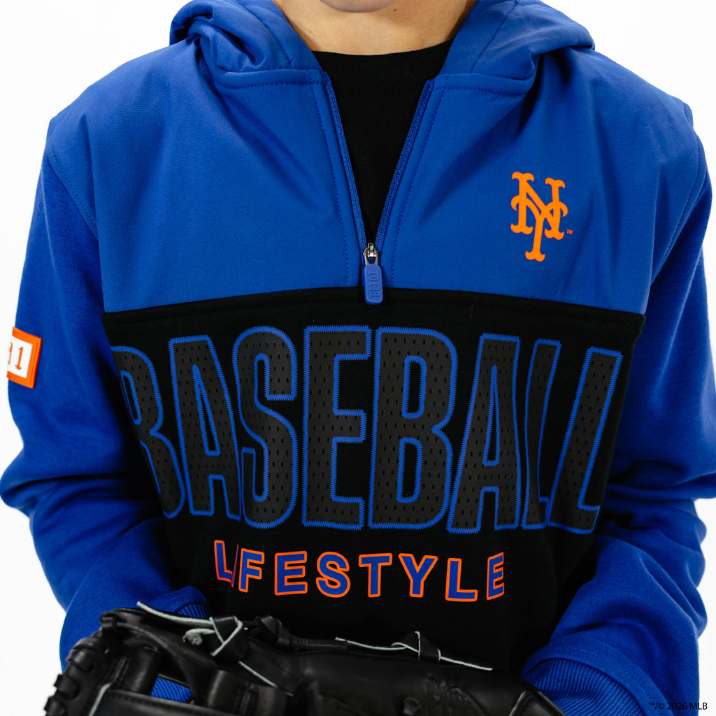 Youth model wearing blue New York Mets Color Block youth quarter zip