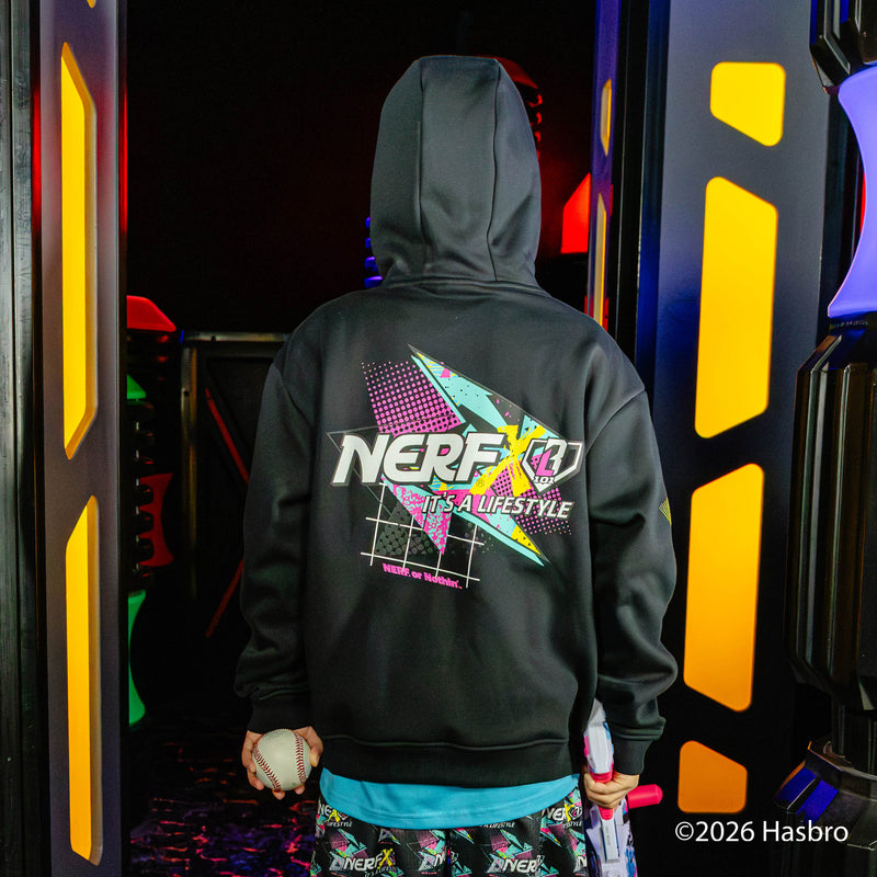 Person wearing a hoodie with 'BL101 X NERF' branding in an indoor play area.