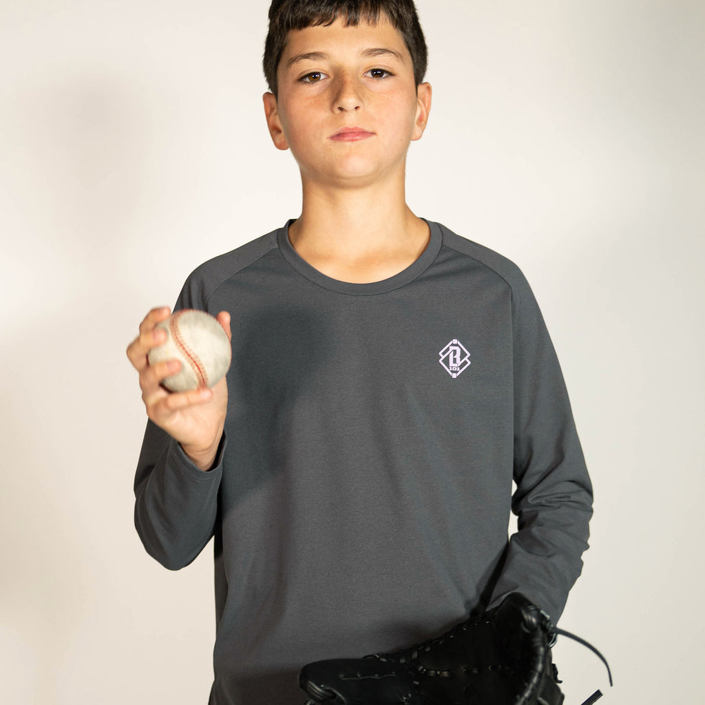 Youth model wearing gray and lilac Diamond Tech youth long sleeve