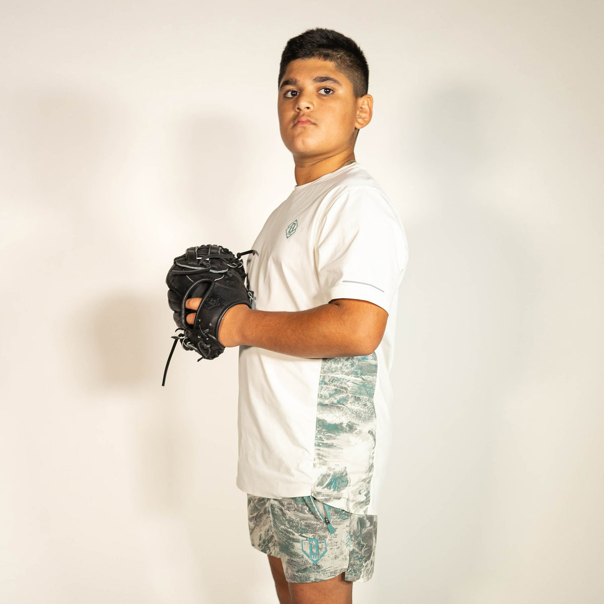 Youth model wearing white Realtree Aspect Diamond Tech Camo youth vented tee
