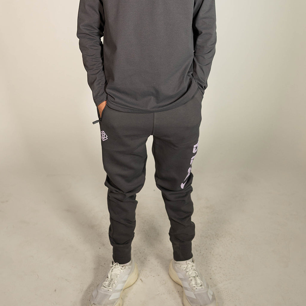 Youth model wearing gray and lilac Diamond Relaxed Fit youth joggers