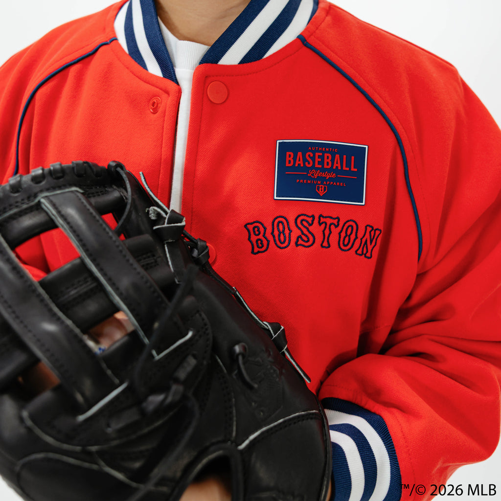 Youth model wearing red Boston Red Sox Stadium youth bomber jacket